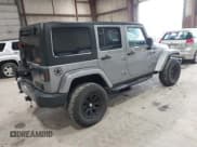 ✅ 2015 Jeep Wrangler Unlimited Sport • VIN: 1C4BJWDG6FL560841 • Lot: 42322086. Listed on IAAI with 99,098 mi. Free auction sales archive from the USA and detailed vehicle history report at DreamBid. Image 4.