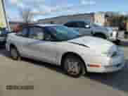 1999 Saturn SC with VIN 1G8ZR1275XZ375833, listed as a Copart auction lot 87960885 with 97,697 mi miles and Salvage title. Bid and sale history available at DreamBid. Image 4.