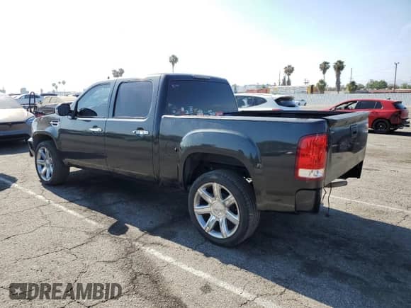 2009 GMC Sierra 1500 with VIN 2GTEC230691130743, listed as a Copart auction lot 60643155 with 140,455 mi miles and Salvage title. Bid and sale history available at DreamBid. Image 2.