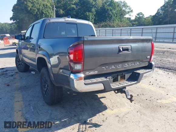 2021 Toyota Tacoma SR5 with VIN 3TMAZ5CN6MM156108, listed as a IAAI auction lot 43109704 with 108,262 mi miles and . Bid and sale history available at DreamBid. Image 3.