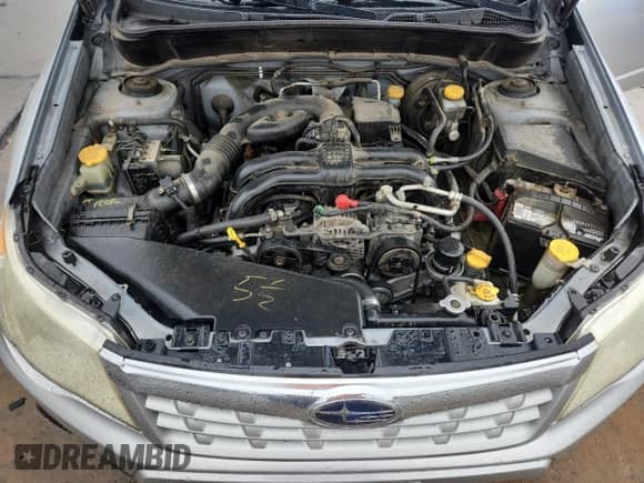 2011 Subaru Forester X z VIN JF2SHBBC9BG723345, wystawiony jako Copart lot #81730085 z przebiegiem 173 477 mil mil oraz Szkoda całkowita • Salvage title. Historia ofert i sprzedaży dostępna na DreamBid. Obrazek 12.