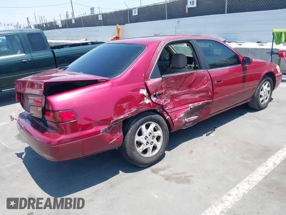 1997 Toyota Camry LE z VIN JT2BF22K9V0077628, wystawiony jako IAAI lot #42770453 z przebiegiem 257 721 mil mil oraz . Historia ofert i sprzedaży dostępna na DreamBid. Obrazek 4.