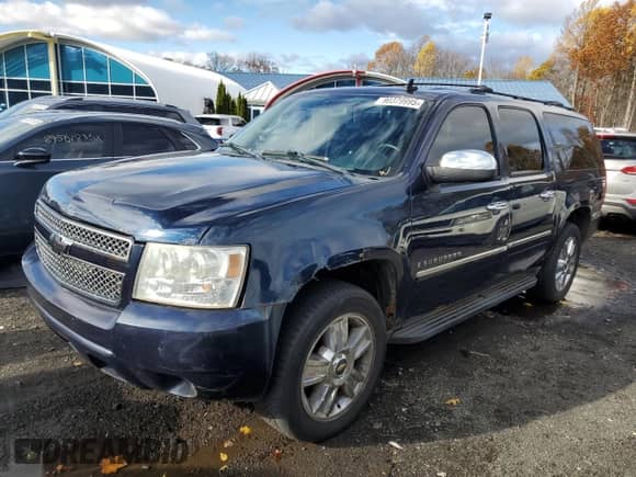 2009 Chevrolet Suburban LTZ z VIN 1GNFK36309R243475, wystawiony jako Copart lot #90379995 z przebiegiem 168 390 mil mil oraz Szkoda całkowita • Salvage title. Historia ofert i sprzedaży dostępna na DreamBid. Obrazek 1.