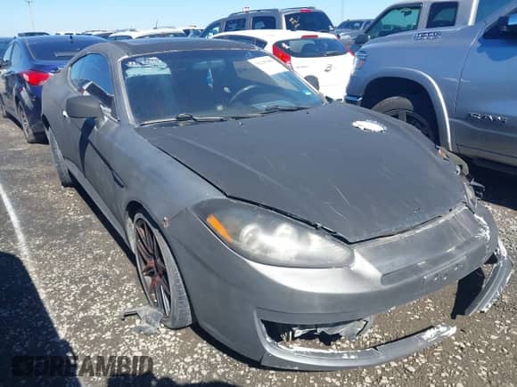 2007 Hyundai Tiburon GT с VIN KMHHN66F97U235966, выставлен на аукционе IAAI как лот 41560704 с пробегом 255 041 миль миль и . История ставок и продаж доступна на DreamBid. Изображение 1.