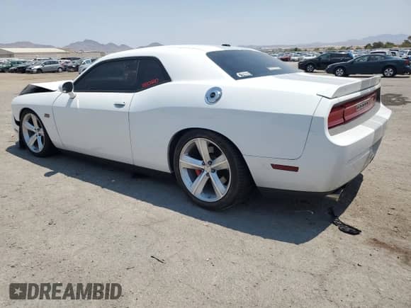 2012 Dodge Challenger SRT-8 392 с VIN 2C3CDYCJ6CH167309, выставлен на аукционе Copart как лот 64902735 с пробегом 124 180 миль миль и Списание • Salvage title. История ставок и продаж доступна на DreamBid. Изображение 2.