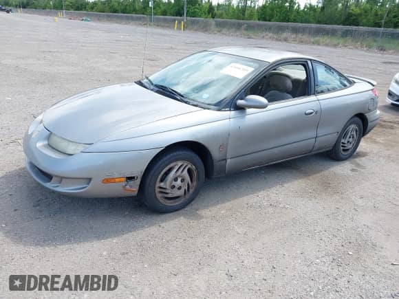 1997 Saturn 2dr Coupe with VIN 1G8ZH1272VZ343437, listed as a IAAI auction lot 42466709 with 280,124 mi miles and . Bid and sale history available at DreamBid. Image 2.