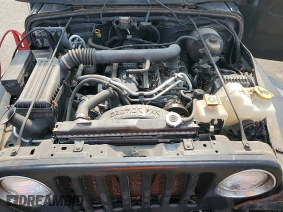 2003 Jeep Wrangler X z VIN 1J4FA39S23P359983, wystawiony jako Copart lot #59469005 z przebiegiem 118 585 mil mil oraz Czysty tytuł • Clean title. Historia ofert i sprzedaży dostępna na DreamBid. Obrazek 12.