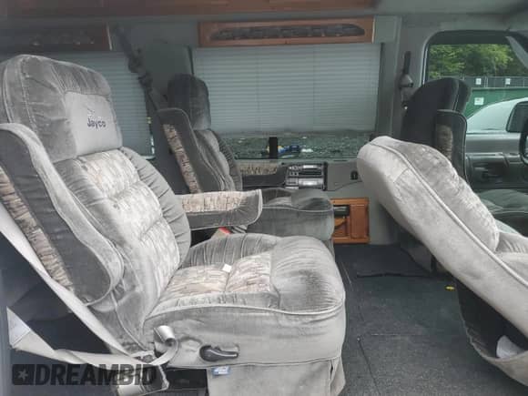 2000 Ford Econoline Cargo Recreational with VIN 1FDRE14L3YHA17676, listed as a Copart auction lot 58571465 with 174,129 mi miles and Salvage title. Bid and sale history available at DreamBid. Image 11.