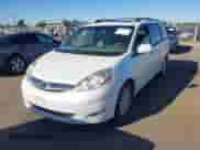 2009 Toyota Sienna XLE with VIN 5TDZK22C59S276897, listed as a IAAI auction lot 43165842 with 214,043 mi miles and . Bid and sale history available at DreamBid. Image 2.