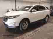 2018 Chevrolet Equinox Premier z VIN 2GNAXVEV6J6303124, wystawiony jako IAAI lot #43150684 z przebiegiem 91 946 mil mil oraz . Historia ofert i sprzedaży dostępna na DreamBid. Obrazek 2.