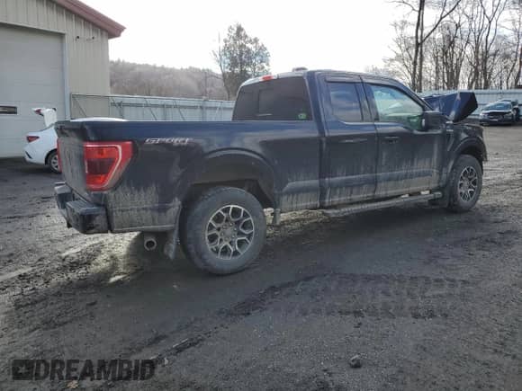 2022 Ford F-150 XL with VIN 1FTFX1E83NFB75003, listed as a Copart auction lot 84709724 with 21,516 mi miles and Salvage title. Bid and sale history available at DreamBid. Image 3.