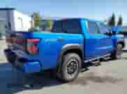 2025 Nissan Frontier Pro-4X with VIN 1N6ED1EK5SN632702, listed as a Copart auction lot 63164255 with 1,917 mi miles and Salvage title. Bid and sale history available at DreamBid. Image 3.