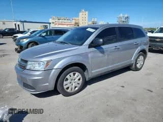2015 Dodge Journey American Value with VIN 3C4PDCAB1FT735635, listed as a Copart auction lot 87420745 with 185,057 mi miles and Salvage title. Bid and sale history available at DreamBid. Image 1.