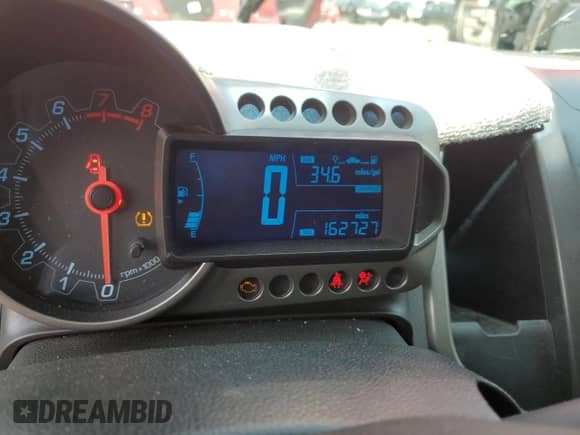 2012 Chevrolet Sonic LT z VIN 1G1JD6SH2C4131208, wystawiony jako Copart lot #59522115 z przebiegiem 162 727 mil mil oraz Szkoda całkowita • Salvage title. Historia ofert i sprzedaży dostępna na DreamBid. Obrazek 9.