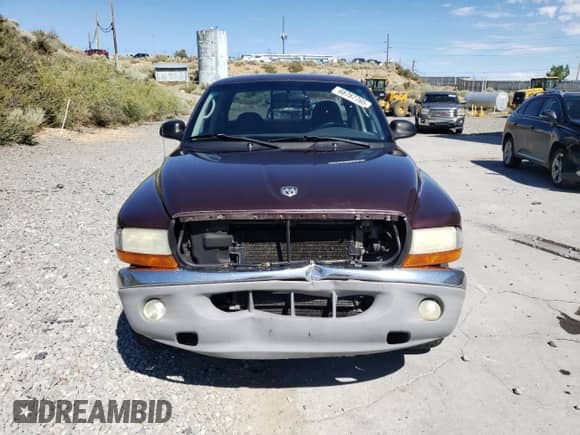 2004 Dodge Dakota SLT z VIN 1D7HG42N24S691756, wystawiony jako Copart lot #68787765 z przebiegiem 142 437 mil mil oraz Szkoda całkowita • Salvage title. Historia ofert i sprzedaży dostępna na DreamBid. Obrazek 5.