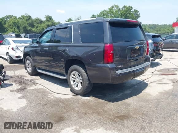 2015 Chevrolet Tahoe LTZ with VIN 1GNSKCKC2FR588524, listed as a IAAI auction lot 42851274 with 101,426 mi miles and . Bid and sale history available at DreamBid. Image 3.