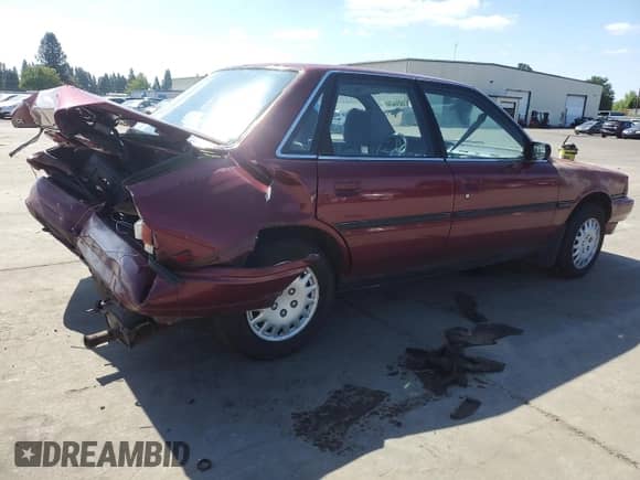 1991 Toyota Camry DLX с VIN 4T1SV21E7MU414824, выставлен на аукционе Copart как лот 61604434 с пробегом 170 867 миль миль и Списание • Salvage title. История ставок и продаж доступна на DreamBid. Изображение 3.