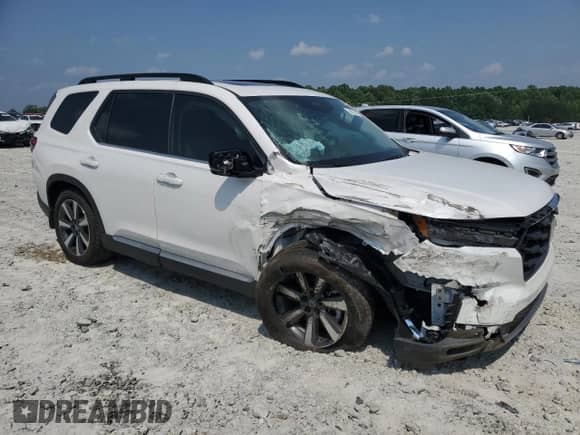 2023 Honda Pilot Touring с VIN 5FNYG2H77PB014212, выставлен на аукционе Copart как лот 59222715 с пробегом 4 507 миль миль и Списание • Salvage title. История ставок и продаж доступна на DreamBid. Изображение 4.