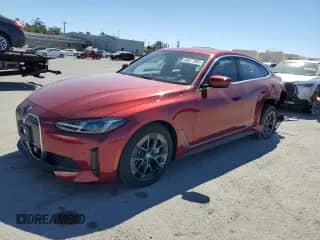 2025 BMW i4 xDrive40 with VIN WBY43HD07SFU82899, listed as a Copart auction lot 69577395 with 3,703 mi miles and Salvage title. Bid and sale history available at DreamBid. Image 1.