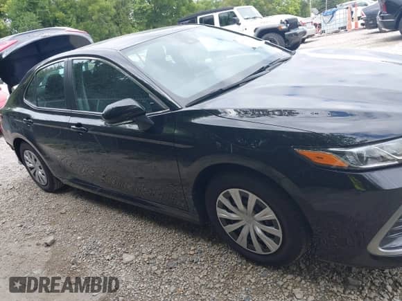 2022 Toyota Camry Hybrid LE with VIN 4T1C31AK3NU574937, listed as a IAAI auction lot 43038140 with 50,708 mi miles and . Bid and sale history available at DreamBid. Image 14.