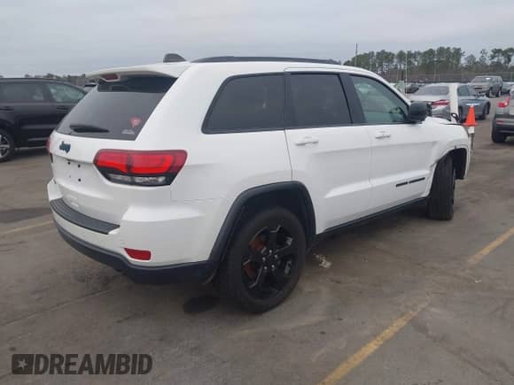 2018 Jeep Grand Cherokee Laredo E z VIN 1C4RJFAG2JC503130, wystawiony jako IAAI lot #41527333 z przebiegiem 95 669 mil mil oraz . Historia ofert i sprzedaży dostępna na DreamBid. Obrazek 4.