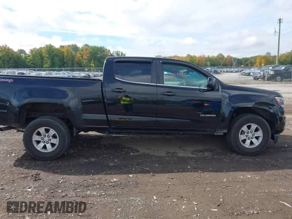 2016 Chevrolet Colorado 4WD WT z VIN 1GCGTBE30G1379817, wystawiony jako IAAI lot #43284954 z przebiegiem 88 749 mil mil oraz . Historia ofert i sprzedaży dostępna na DreamBid. Obrazek 13.