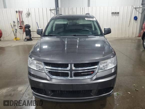 2016 Dodge Journey SE z VIN 3C4PDCAB9GT186896, wystawiony jako Copart lot #66667785 z przebiegiem 202 884 mil mil oraz Szkoda całkowita • Salvage title. Historia ofert i sprzedaży dostępna na DreamBid. Obrazek 5.