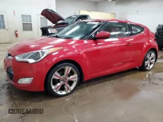 2012 Hyundai Veloster w/Black Int z VIN KMHTC6AD3CU049324, wystawiony jako Copart lot #85596195 z przebiegiem 171 178 mil mil oraz Szkoda całkowita • Salvage title. Historia ofert i sprzedaży dostępna na DreamBid. Obrazek 1.
