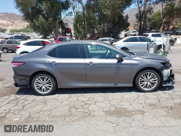2020 Toyota Camry Hybrid XLE with VIN 4T1F31AK0LU527228, listed as a IAAI auction lot 42532828 with 99,749 mi miles and . Bid and sale history available at DreamBid. Image 14.