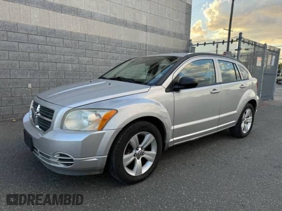 2010 Dodge Caliber SXT с VIN 1B3CB4HA1AD579409, выставлен на аукционе Copart как лот 91408935 с пробегом 100 311 миль миль и Чистый • Clean title. История ставок и продаж доступна на DreamBid. Изображение 2.