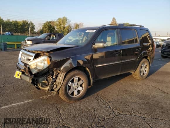 2010 Honda Pilot Touring with VIN 5FNYF4H87AB038749, listed as a Copart auction lot 69882305 with 141,496 mi miles and Salvage title. Bid and sale history available at DreamBid. Image 1.