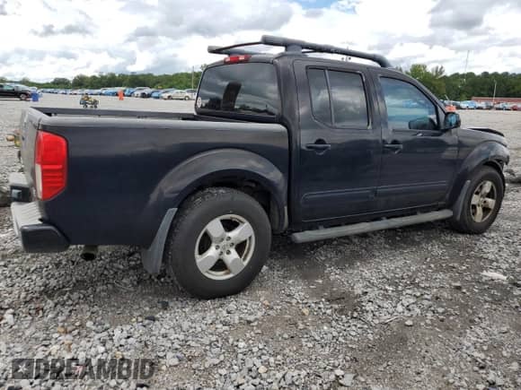 2005 Nissan Frontier SE with VIN 1N6AD07U15C424064, listed as a Copart auction lot 68090785 with 153,296 mi miles and Salvage title. Bid and sale history available at DreamBid. Image 3.
