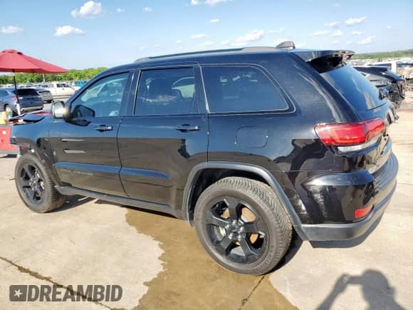 2021 Jeep Grand Cherokee Laredo E with VIN 1C4RJEAG5MC785858, listed as a Copart auction lot 54128005 with 95,849 mi miles and Salvage title. Bid and sale history available at DreamBid. Image 2.