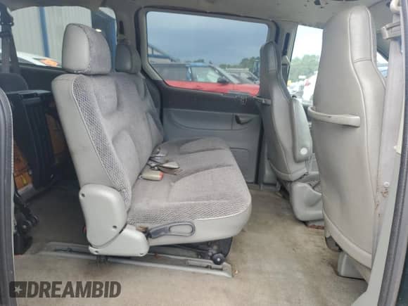 1997 Dodge Caravan SE z VIN 2B4GP44R4VR202585, wystawiony jako Copart lot #68703985 z przebiegiem 188 500 mil mil oraz Szkoda całkowita • Salvage title. Historia ofert i sprzedaży dostępna na DreamBid. Obrazek 11.