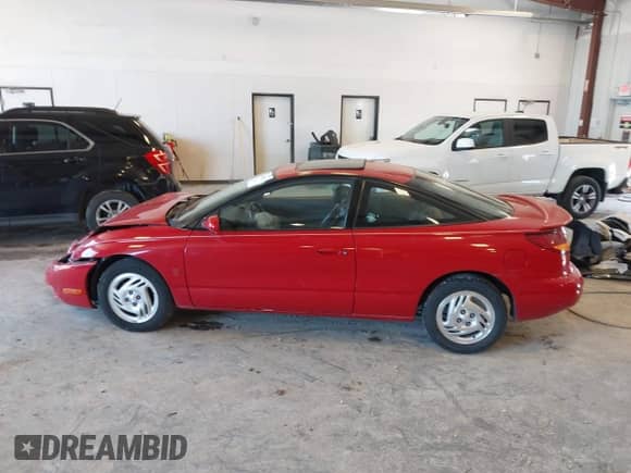 1997 Saturn 2dr Coupe with VIN 1G8ZH1277VZ110038, listed as a IAAI auction lot 42546514 with 83,164 mi miles and . Bid and sale history available at DreamBid. Image 14.