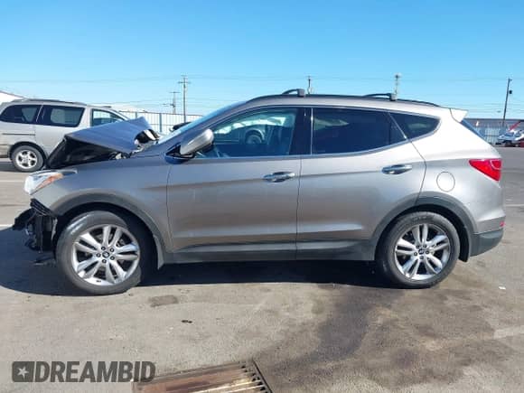 2013 Hyundai Santa Fe Sport z VIN 5XYZUDLA3DG077162, wystawiony jako IAAI lot #43326274 z przebiegiem Nie podano mil oraz . Historia ofert i sprzedaży dostępna na DreamBid. Obrazek 14.