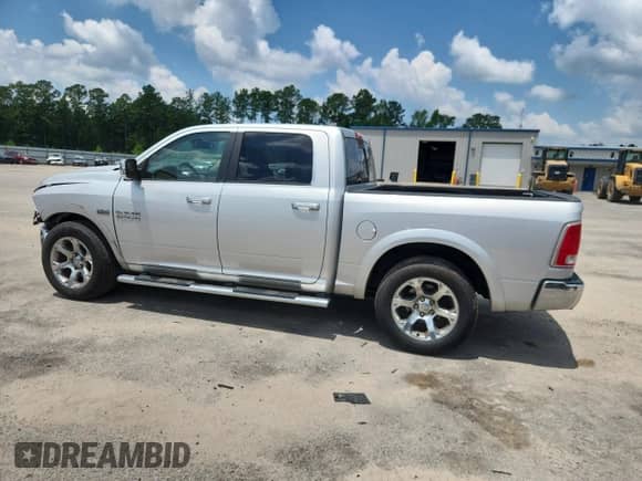 2014 Ram 1500 Laramie with VIN 1C6RR6NT0ES397960, listed as a Copart auction lot 61458895 with 148,298 mi miles and Salvage title. Bid and sale history available at DreamBid. Image 2.