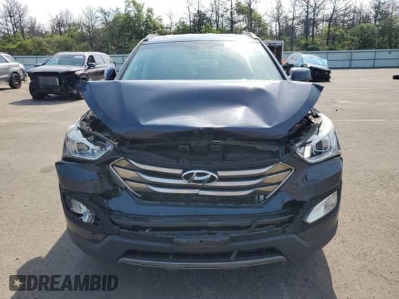 2015 Hyundai Santa Fe with VIN 5XYZUDLB0FG279064, listed as a Copart auction lot 63467345 with 69,935 mi miles and Salvage title. Bid and sale history available at DreamBid. Image 5.