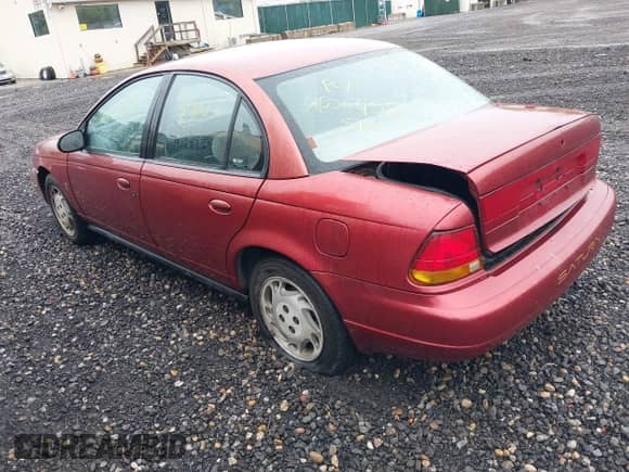 1996 Saturn SL z VIN 1G8ZK5273TZ268401, wystawiony jako IAAI lot #42194239 z przebiegiem Nie podano mil oraz . Historia ofert i sprzedaży dostępna na DreamBid. Obrazek 3.