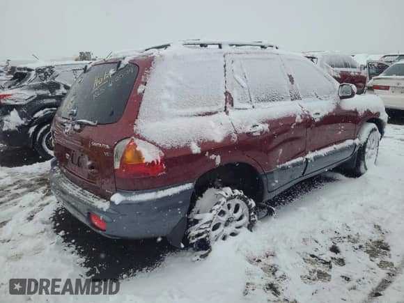 2002 Hyundai Santa Fe GLS z VIN KM8SC73D82U229282, wystawiony jako Copart lot #82037604 z przebiegiem Nie podano mil oraz Szkoda całkowita • Salvage title. Historia ofert i sprzedaży dostępna na DreamBid. Obrazek 3.