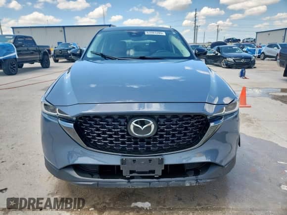 2023 Mazda CX-5 S Carbon Edition z VIN JM3KFBCM1P0105696, wystawiony jako Copart lot #63983385 z przebiegiem 23 736 mil mil oraz Czysty tytuł • Clean title. Historia ofert i sprzedaży dostępna na DreamBid. Obrazek 5.