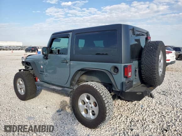 2014 Jeep Wrangler Sport with VIN 1C4AJWAG0EL308436, listed as a Copart auction lot 81949885 with 123,925 mi miles and Salvage title. Bid and sale history available at DreamBid. Image 2.