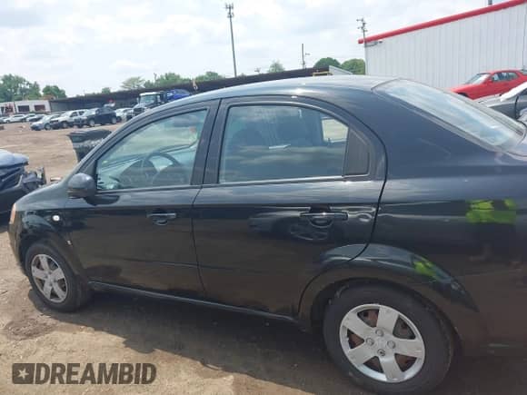 2007 Chevrolet Aveo LS with VIN KL1TD56627B055436, listed as a IAAI auction lot 42462092 with 102,923 mi miles and . Bid and sale history available at DreamBid. Image 14.