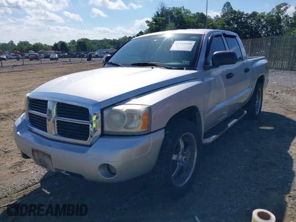 2006 Dodge Dakota SLT with VIN 1D7HE48K76S610868, listed as a IAAI auction lot 42542808 with 244,951 mi miles and . Bid and sale history available at DreamBid. Image 2.