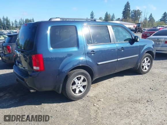 2009 Honda Pilot Touring with VIN 5FNYF489X9B007452, listed as a IAAI auction lot 43262557 with 206,355 mi miles and . Bid and sale history available at DreamBid. Image 4.