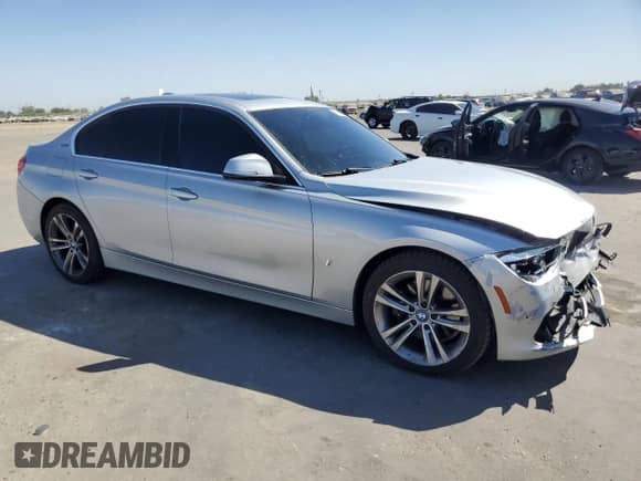 2018 BMW 3 Series 330e with VIN WBA8E1C52JA167468, listed as a Copart auction lot 69873605 with 98,631 mi miles and Salvage title. Bid and sale history available at DreamBid. Image 4.