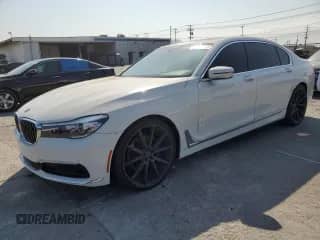 2017 BMW 7 Series 740i xDrive with VIN WBA7E4C59HGU99458, listed as a Copart auction lot 65413575 with 80,859 mi miles and Salvage title. Bid and sale history available at DreamBid. Image 1.