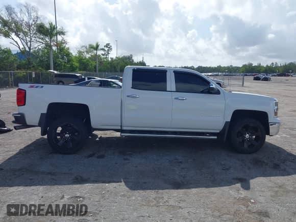 2014 Chevrolet Silverado 1500 LT with VIN 3GCUKREC4EG165040, listed as a IAAI auction lot 42496096 with 145,527 mi miles and . Bid and sale history available at DreamBid. Image 14.