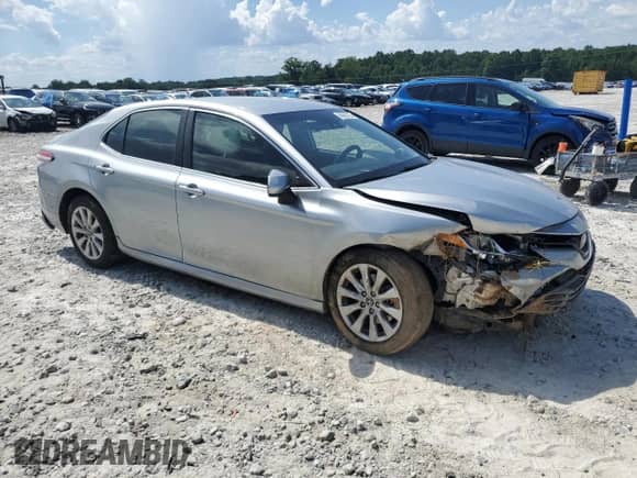 2019 Toyota Camry LE с VIN 4T1B11HKXKU193153, выставлен на аукционе Copart как лот 66660725 с пробегом 130 057 миль миль и Списание • Salvage title. История ставок и продаж доступна на DreamBid. Изображение 4.