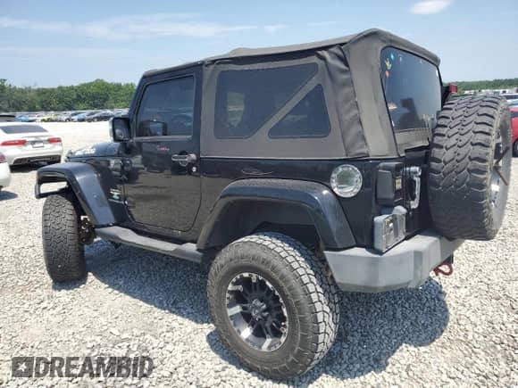 2007 Jeep Wrangler Sahara z VIN 1J4FA54157L212192, wystawiony jako Copart lot #63062135 z przebiegiem 146 048 mil mil oraz Szkoda całkowita • Salvage title. Historia ofert i sprzedaży dostępna na DreamBid. Obrazek 2.